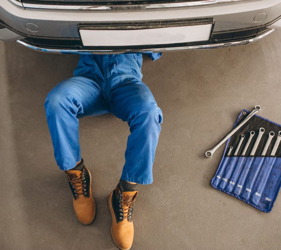 auto-mechanic-checking-car_1303-14035